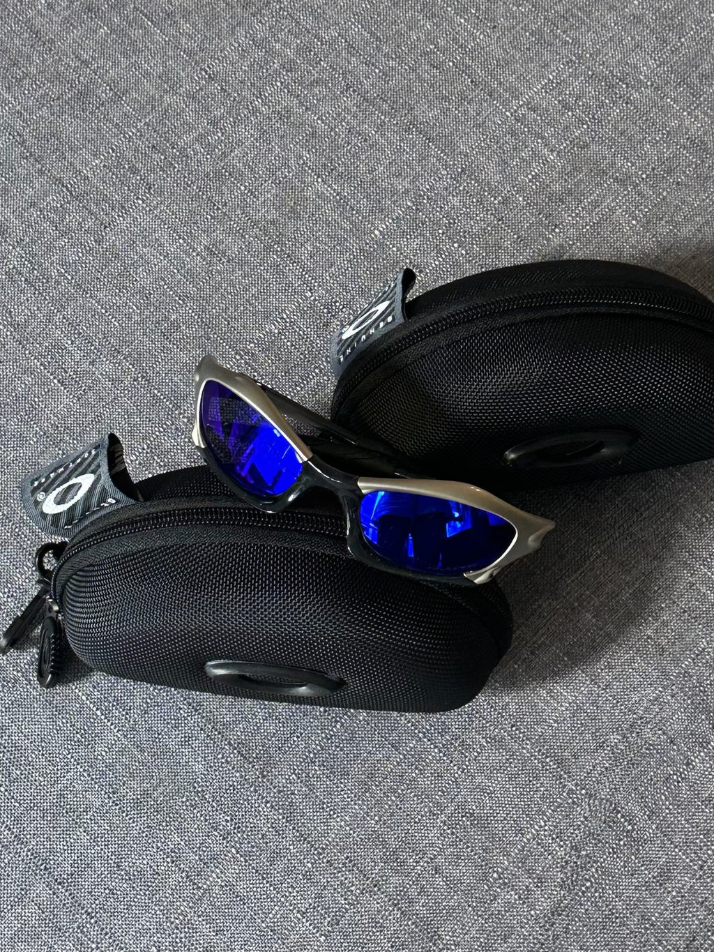 Vintage Oakley Sunglasses: Polished Silver Frame, Blue Lenses - Vintage Collectible