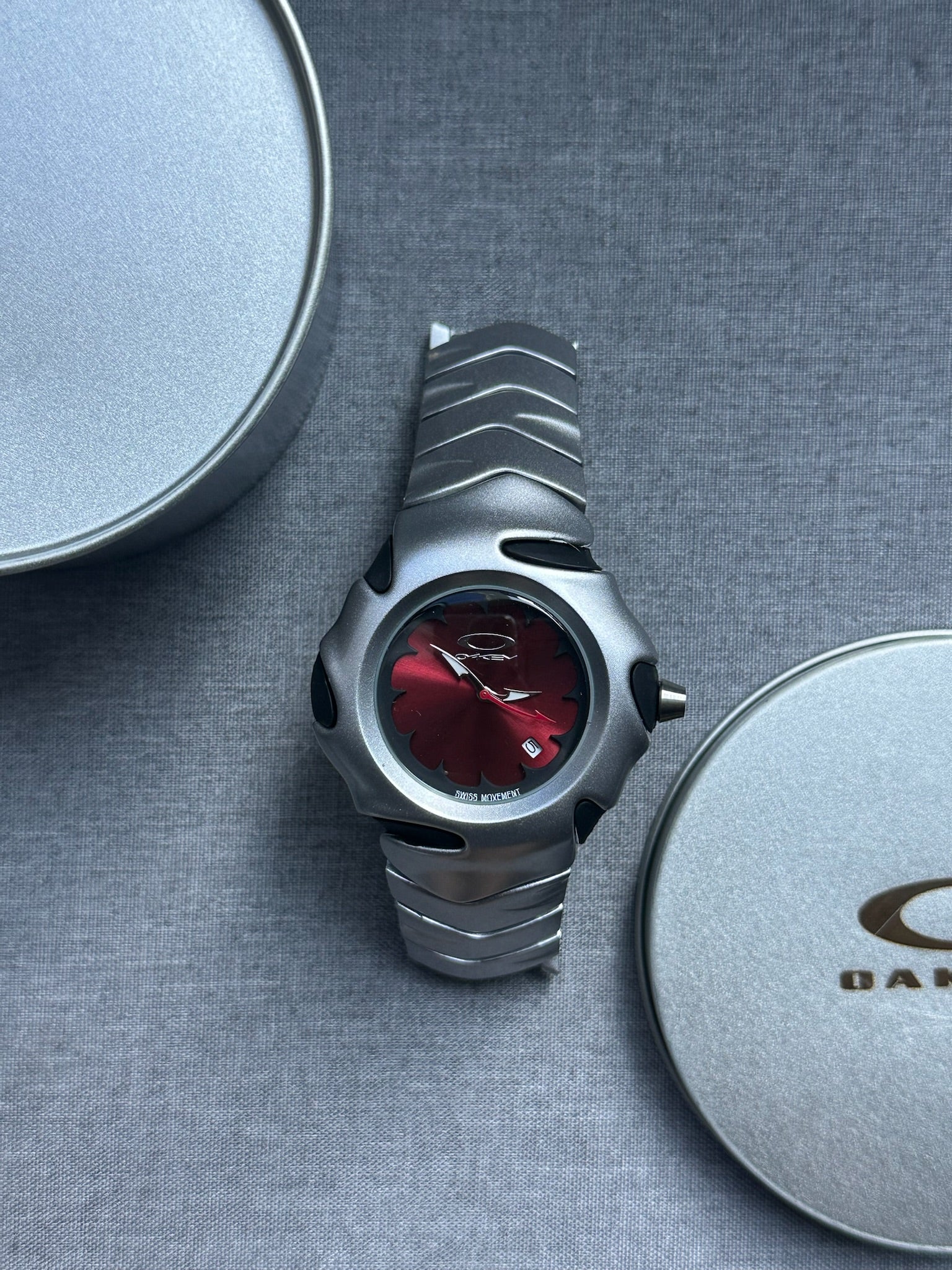 Oakley Blade Watch: Silver Brushed Stainless Steel with Red Dial, Swiss Movement