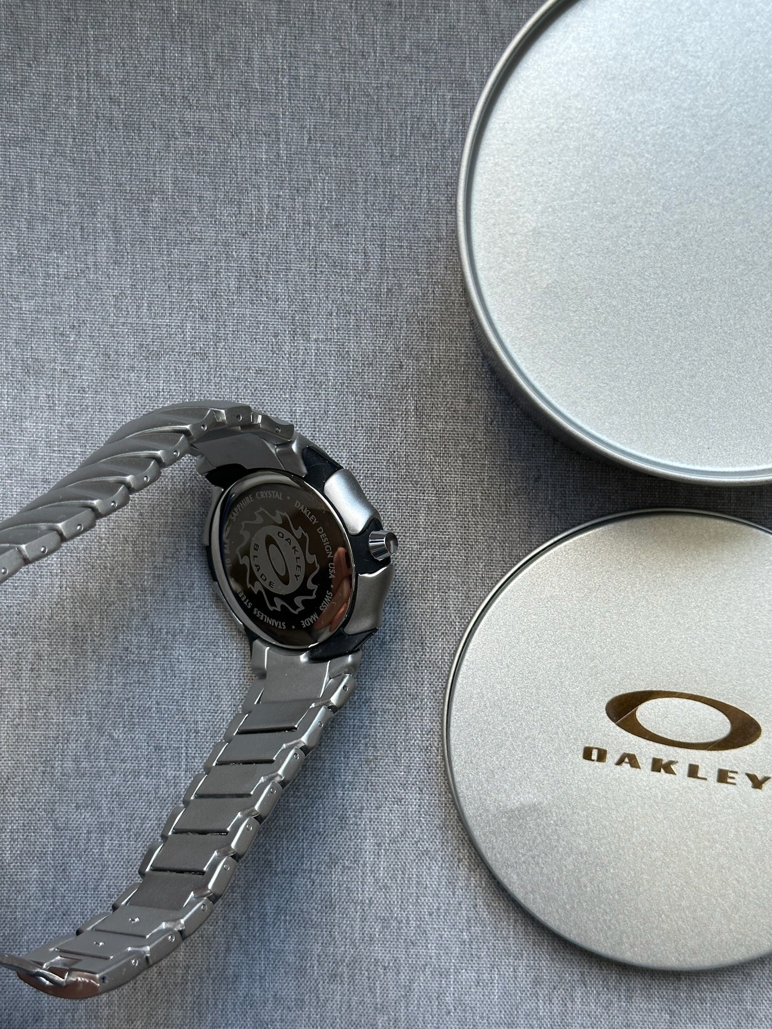 Oakley Blade Watch: Silver Brushed Stainless Steel with Blue Dial, Swiss Movement