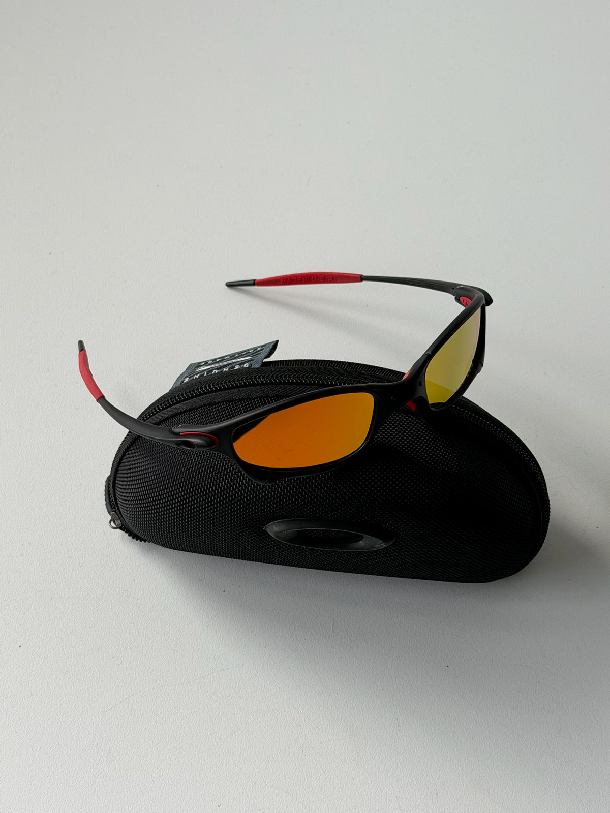 Vintage Oakley Juliet 1.0 – Black & Red Frame / Fire Orange Mirror Lens