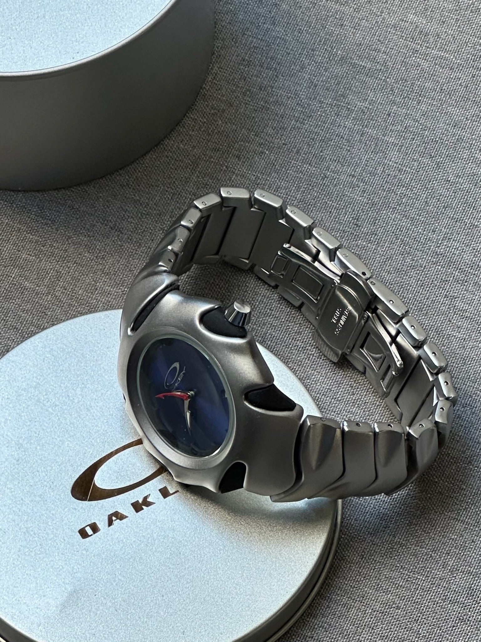 Oakley Blade Watch: Silver Brushed Stainless Steel with Blue Dial, Swiss Movement
