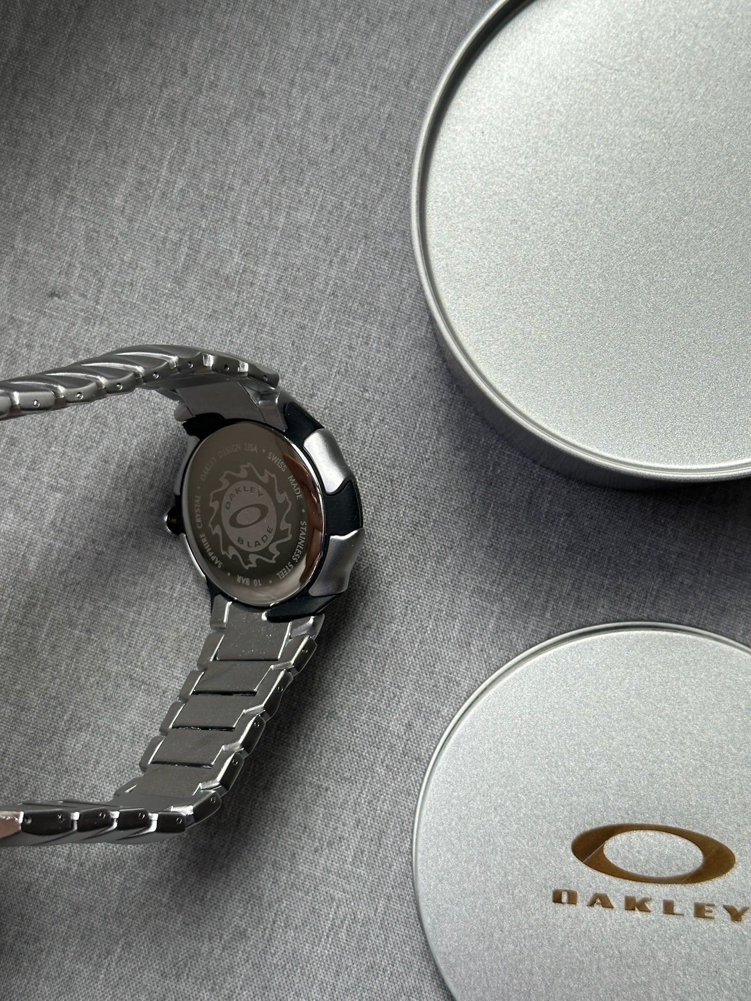 Oakley Blade Watch: Silver Stainless Steel Brushed with White Dial, Swiss Movement