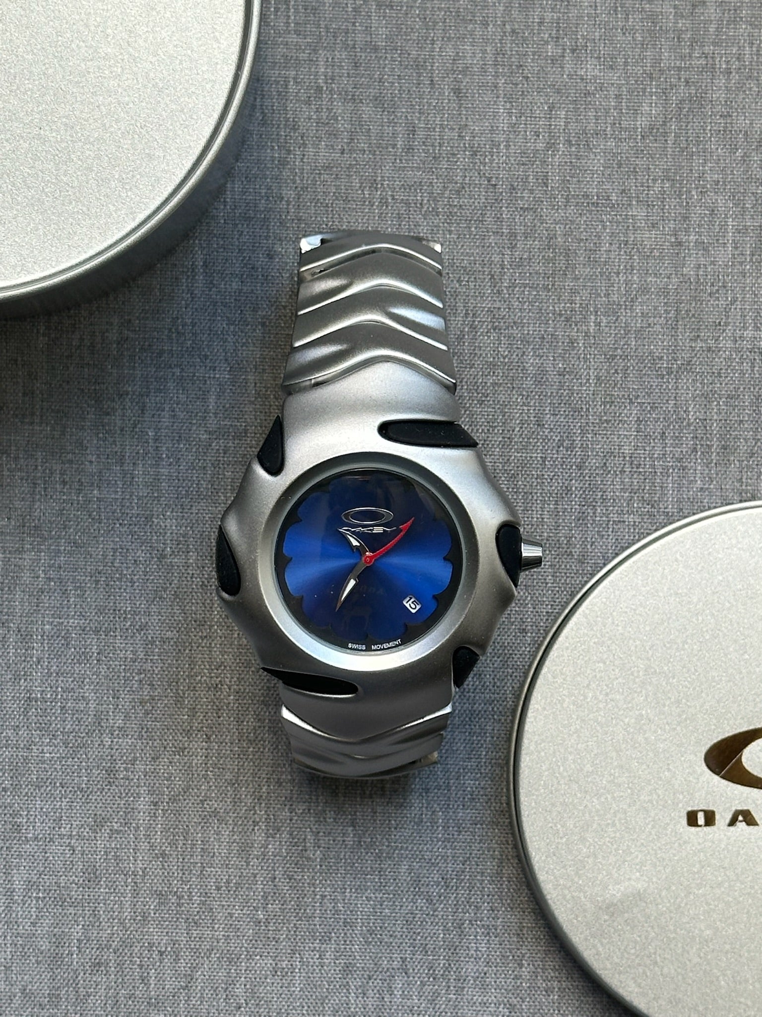 Oakley Blade Watch: Silver Brushed Stainless Steel with Blue Dial, Swiss Movement