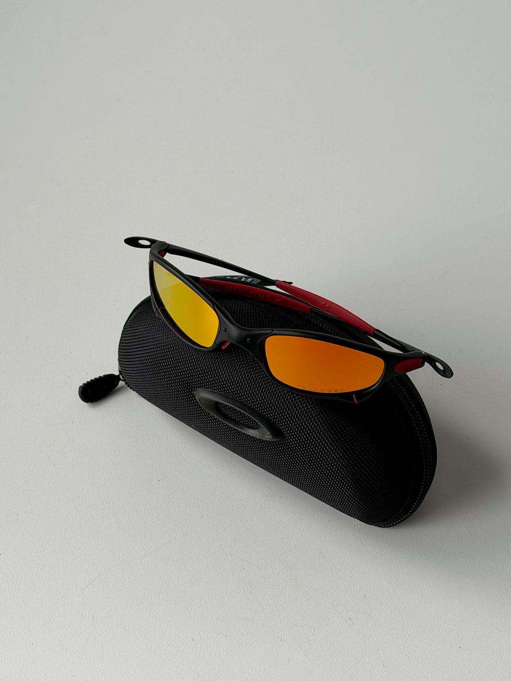 Vintage Oakley Juliet 1.0 – Black & Red Frame / Fire Orange Mirror Lens