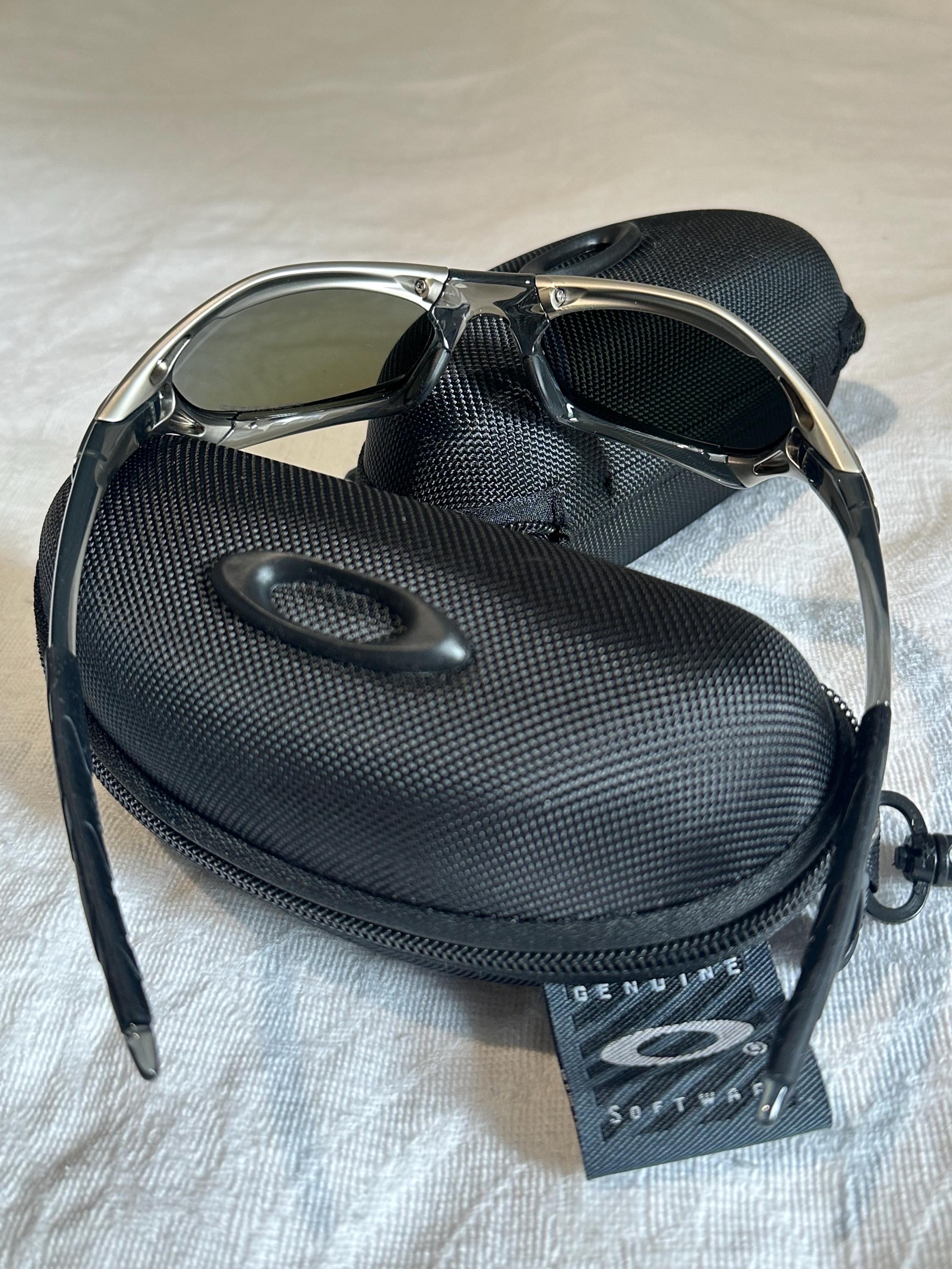 Vintage Oakley Sunglasses: Polished Silver Frame, Blue Lenses - Vintage Collectible