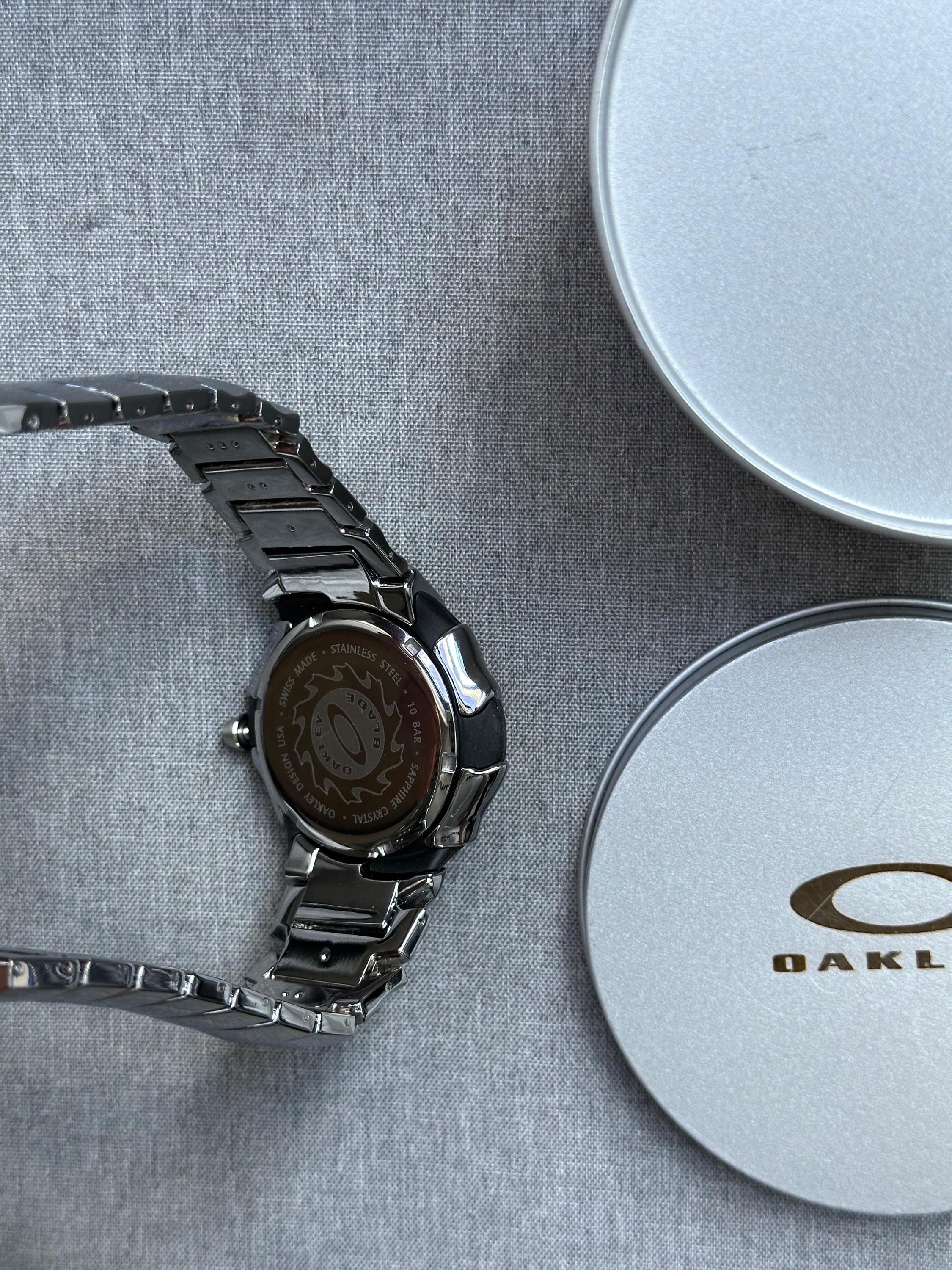 Oakley Time Tank Watch – White Dial Silver SHINY Stainless Steel with Smooth Reflective Strap, Swiss Movement, Collectible Men’s Watch